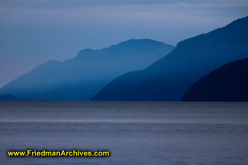 nature,dusk,dawn,blue,mountains,clouds,smoke,water,horizon,boating,canoeing,scenic,landscape,